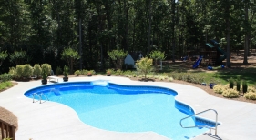 Freeform Pool with Diving Board and Pool Seat
